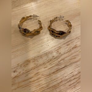 Gold toned wavy hoop earrings
